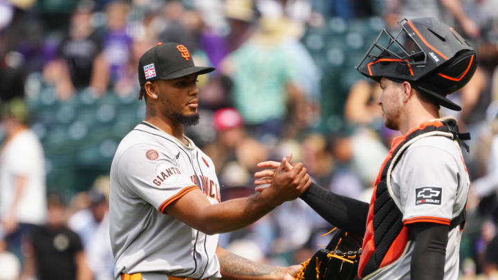 Jul 21, 2024; Denver, Colorado, USA; San Francisco Giants pitcher Camilo Doval (75) and catcher Patrick Bailey (14) celebrate defeating the Colorado Rockies at Coors Field.