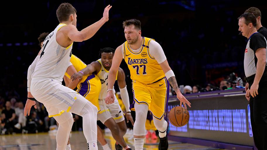 Los Angeles Lakers guard Luka Dončić drives past Utah Jazz center Walker Kessler.