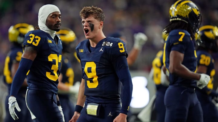 Jan 8, 2024; Houston, TX, USA; Michigan Wolverines quarterback J.J. McCarthy (9) celebrates from the sidelines during the fourth quarter against the Washington Huskies in the 2024 College Football Playoff national championship game at NRG Stadium. Mandatory Credit: Kirby Lee-USA TODAY Sports