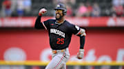 Sep 25, 2025; Arlington, Texas, USA; Minnesota Twins center fielder Byron Buxton (25) celebrates as he rounds the bases after hitting a three run home run against the Texas Rangers during the eighth inning at Globe Life Field.