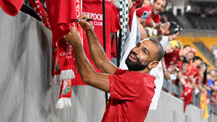 Jul 26, 2024; Pittsburgh, PA, USA; Liverpool forward Mohamed Salah (11) signs autographs for fans after playing against Real Betis at Acrisure Stadium. Mandatory Credit: Barry Reeger-Imagn Images