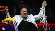 Apr 7, 2024; Cleveland, OH, USA; South Carolina Gamecocks head coach Dawn Staley cuts the net after defeating Iowa in the National Title game