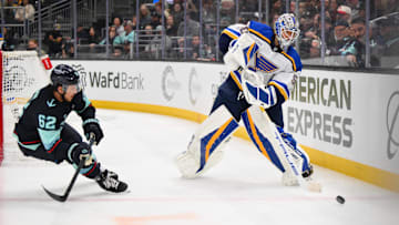 Apr 12, 2025; Seattle, Washington, USA; St. Louis Blues goaltender Jordan Binnington (50) passes the puck against the Seattle Kraken during the second period at Climate Pledge Arena. Mandatory Credit: Steven Bisig-Imagn Images