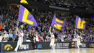 Apr 1, 2024; Albany, NY, USA; The LSU Lady Tigers cheerleaders run the flags before the game against the Iowa Hawkeyes in the finals of the Albany Regional in the 2024 NCAA Tournament at MVP Arena. Mandatory Credit: Gregory Fisher-Imagn Images