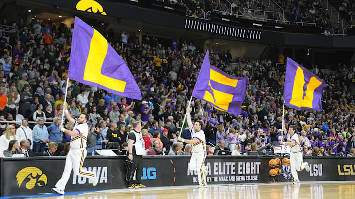 Apr 1, 2024; Albany, NY, USA; The LSU Lady Tigers cheerleaders run the flags before the game against the Iowa Hawkeyes in the finals of the Albany Regional in the 2024 NCAA Tournament at MVP Arena. Mandatory Credit: Gregory Fisher-Imagn Images