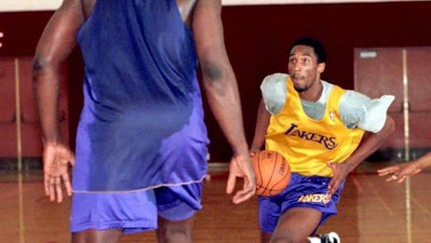 A young Kobe Bryant drives the lane in a training camp practice against Shaquille O'Neal