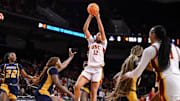Mar 22, 2025; Los Angeles, California, USA; USC Trojans guard JuJu Watkins (12) shoots over UNC Greensboro Spartans guard Jaila Lee (4) during the second quarter of an NCAA Tournament game at Galen Center. Mandatory Credit: Robert Hanashiro-Imagn Images