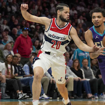 Apr 10, 2022; Charlotte, North Carolina, USA; Charlotte Hornets guard James Bouknight (5) drives to the basket against Washington Wizards forward Jordan Schakel (20) during the second half at Spectrum Center. Mandatory Credit: Jim Dedmon-Imagn Images