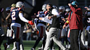 Nov 2, 2025; Foxborough, Massachusetts, USA;  New England Patriots head coach Mike Vrabel high fives linebacker Harold Landry III (2) during the first half against the Atlanta Falcons at Gillette Stadium. Mandatory Credit: Eric Canha-Imagn Images