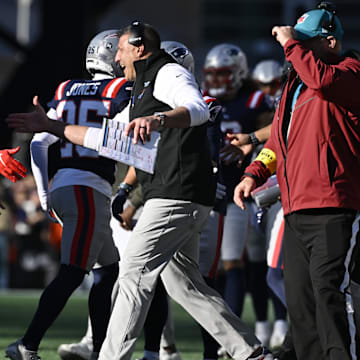 Nov 2, 2025; Foxborough, Massachusetts, USA;  New England Patriots head coach Mike Vrabel high fives linebacker Harold Landry III (2) during the first half against the Atlanta Falcons at Gillette Stadium. Mandatory Credit: Eric Canha-Imagn Images