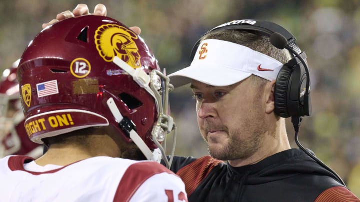 USC Trojans coach Lincoln Riley talks to quarterback Caleb Williams during a game against the Oregon Ducks at Autzen Stadium.