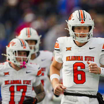 Nov 1, 2025; Lawrence, Kansas, USA; Oklahoma State Cowboys quarterback Zane Flores (6) takes the field during the first half against the Kansas Jayhawks at David Booth Kansas Memorial Stadium. Mandatory Credit: Jay Biggerstaff-Imagn Images