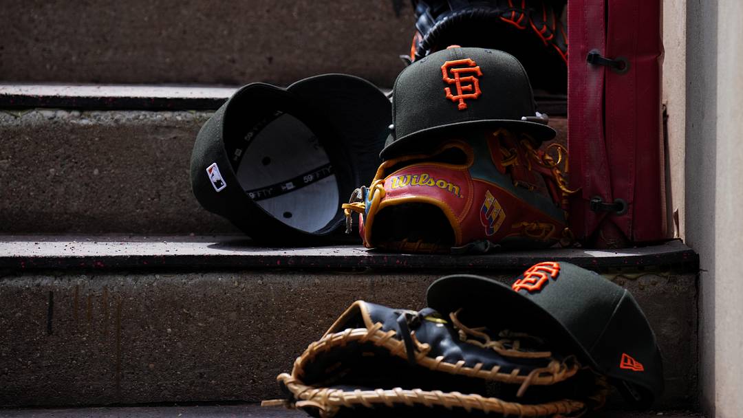 Apr 16, 2026; Cincinnati, Ohio, USA; A view of San Francisco Giants game hats on the dugout steps during the game against the Cincinnati Reds at Great American Ball Park. Mandatory Credit: Aaron Doster-Imagn Images