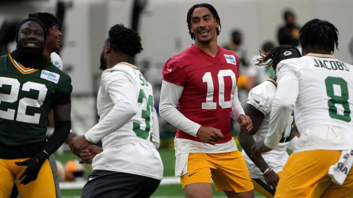 Green Bay Packers quarterback Jordan Love works out with teammates at minicamp.