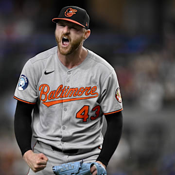 Baltimore Orioles relief pitcher Bryan Baker (43) celebrates after pitching against the Texas Rangers during the eighth inning at Globe Life Field. 