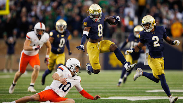Notre Dame safety Adon Shuler returns an interception against Virginia in 202