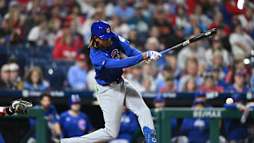 Sep 25, 2024; Philadelphia, Pennsylvania, USA; Chicago Cubs outfielder Kevin Alcantara (13) hits an infield single against the Philadelphia Phillies in the ninth inning at Citizens Bank Park.