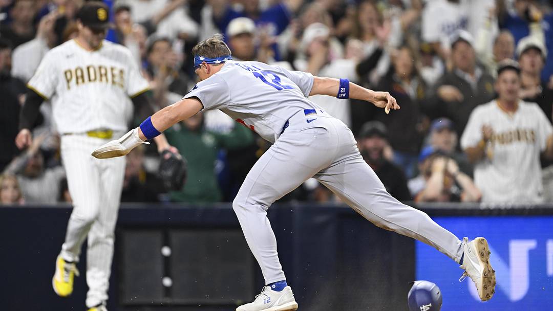 May 19, 2026; San Diego, California, USA; Los Angeles Dodgers left fielder Alex Call (12) scores as San Diego Padres pitcher Mason Miller (22) looks on during the ninth inning at Petco Park. Mandatory Credit: Denis Poroy-Imagn Images