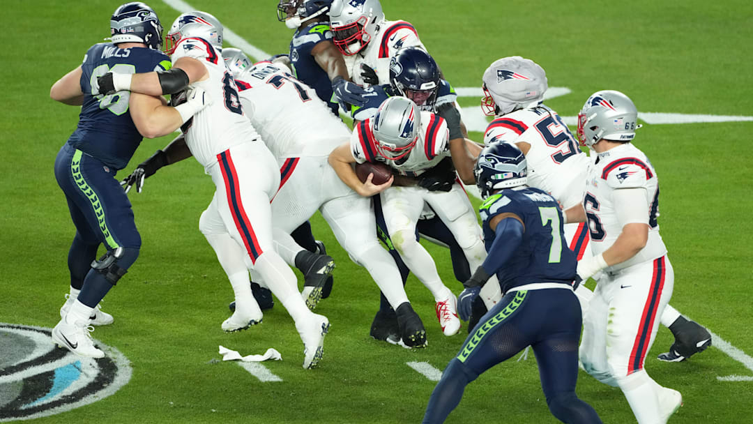 Feb 8, 2026; Santa Clara, CA, USA; New England Patriots quarterback Drake Maye (10) is sacked by Seattle Seahawks defensive tackle Byron Murphy II (91) in the second half in Super Bowl LX at Levi's Stadium. Mandatory Credit: Kirby Lee-Imagn Images