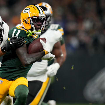 Sep 6, 2024; Sao Paulo, BRA; Green Bay Packers wide receiver Jayden Reed (11) runs against Philadelphia Eagles linebacker Zack Baun (53) during the first half at Neo Quimica Arena. Mandatory Credit: Kirby Lee-Imagn Images