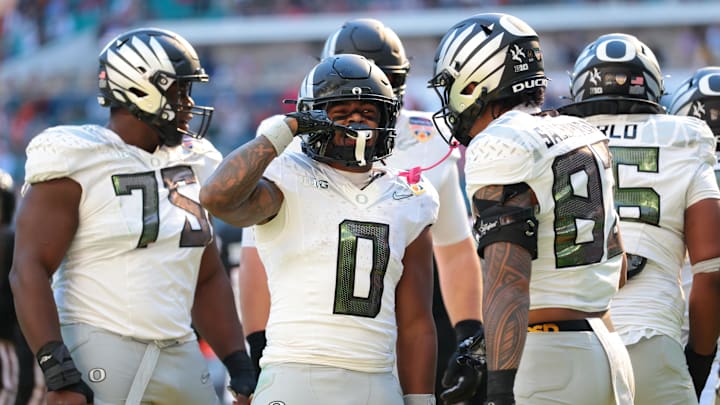 Jan 1, 2026; Miami Gardens, FL, USA; Oregon Ducks running back Jordon Davison (0) reacts after scoring a touchdown against the Texas Tech Red Raiders during the second half of the 2025 Orange Bowl and quarterfinal game of the College Football Playoff at Hard Rock Stadium. Mandatory Credit: Sam Navarro-Imagn Images