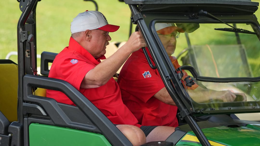 Jul 22, 2024; St. Joseph, MO, USA; Kansas City Chiefs head coach Andy Reid rides a golf cart down the hill from the locker room to the fields prior to training camp at Missouri Western State University. Mandatory Credit: Denny Medley-USA TODAY Sports