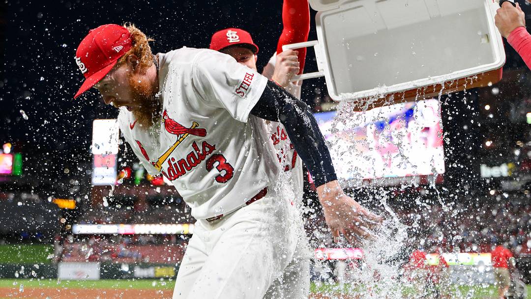 Jun 15, 2026; St. Louis, Missouri, USA; St. Louis Cardinals starting pitcher Dustin May (3) is doused with water by center fielder Nathan Church (27) and shortstop Masyn Winn (0) after throwing a complete game one hitter against the San Diego Padres at Busch Stadium. Mandatory Credit: Jeff Curry-Imagn Images