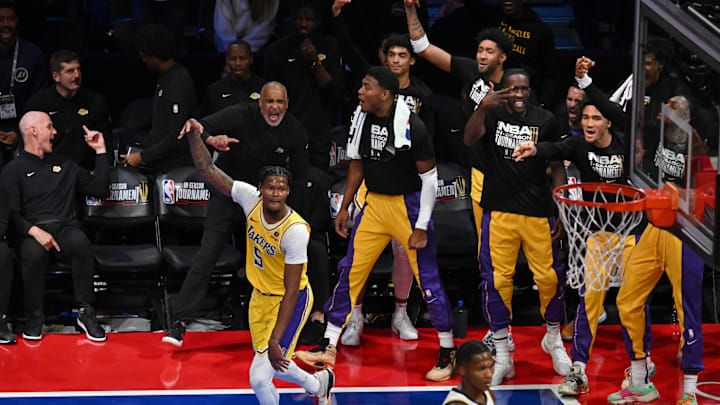 Dec 9, 2023; Las Vegas, Nevada, USA; Los Angeles Lakers forward Cam Reddish (5) reacts in front of the bench after making a three-point basket during the fourth quarter of the NBA In-Season Tournament Championship game against the Indiana Pacers at T-Mobile Arena. Mandatory Credit: Candice Ward-Imagn Images