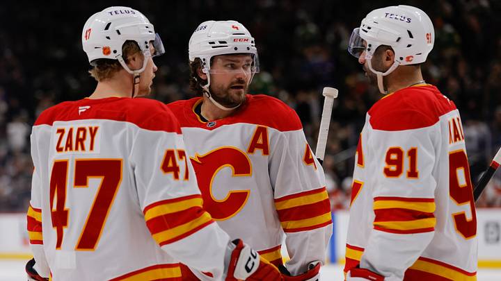 Calgary Flames players Connor Zary, Rasmus Andersson and Nazem Kadri