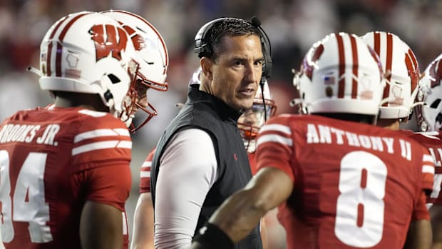 Oct 26, 2024; Madison, Wisconsin, USA;  Wisconsin Badgers head coach Luke Fickell talks to players during the fourth quarter 