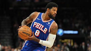 Nov 4, 2024; Phoenix, Arizona, USA; Philadelphia 76ers forward Paul George (8) protects the ball against the Phoenix Suns during the first half at Footprint Center. Mandatory Credit: Joe Camporeale-Imagn Images
