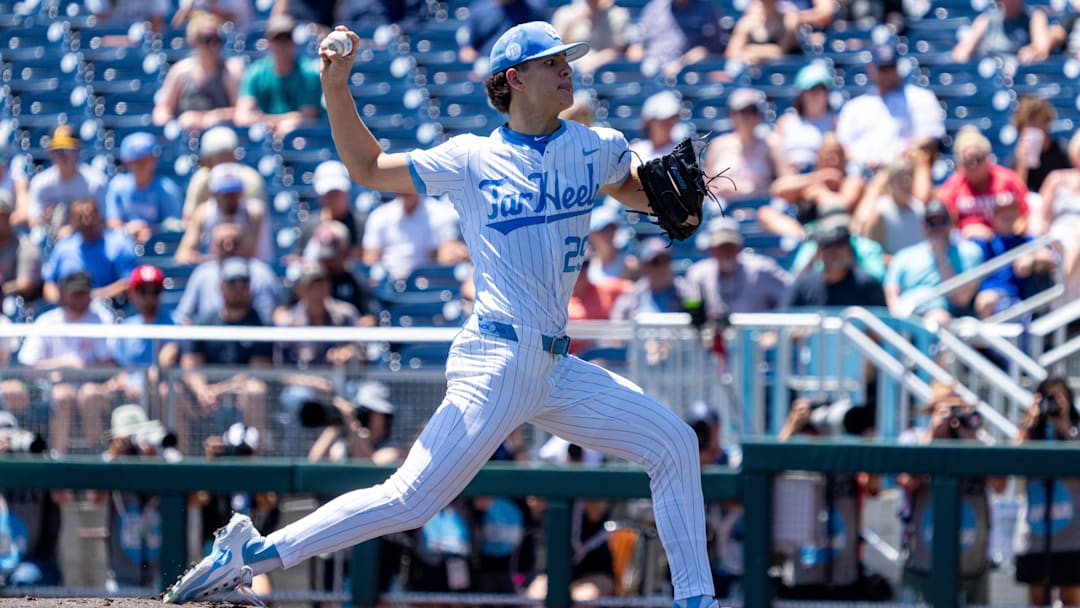 Jun 14, 2024; Omaha, NE, USA; North Carolina Tar Heels starting pitcher Jason DeCaro (29) throws the opening pitch against the Virginia Cavaliers at Charles Schwab Filed Omaha. Mandatory Credit: Dylan Widger-Imagn Images
