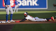 Jul 9, 2025; Minneapolis, Minnesota, USA; Minnesota Twins center fielder Byron Buxton (25) slides into second base successfully after stealing second base against the Chicago Cubs in the first inning at Target Field.