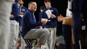 Penn State men's basketball coach Mike Rhoades speaks to the team during the first half against the Virginia Tech Hokies. 