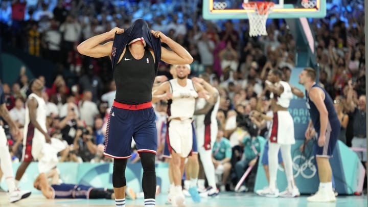 Aug 8, 2024; Paris, France; Serbia shooting guard Bogdan Bogdanovic (7) reacts after the game against the United States in a men's basketball semifinal game during the Paris 2024 Olympic Summer Games at Accor Arena. 