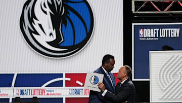 May 12, 2025; Chicago, Illinois, US; Rolando Blackman of the Dallas Mavericks reacts with Mark Tatum NBA Deputy Commissioner after winning the the first pick during the 2025 NBA Draft Lottery at McCormick Place. Mandatory Credit: David Banks-Imagn Images