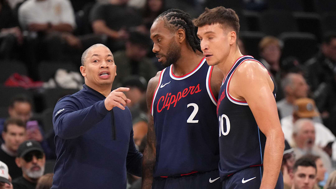 Feb 12, 2025; Inglewood, California, USA; 
LA Clippers coach Tyronn Lue (left) talks with forward Kawhi Leonard (2) and guard Bogdan Bogdanovic (10) against the Memphis Grizzlies in the first half at Intuit Dome. Mandatory Credit: Kirby Lee-Imagn Images