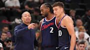 Feb 12, 2025; Inglewood, California, USA; 
LA Clippers coach Tyronn Lue (left) talks with forward Kawhi Leonard (2) and guard Bogdan Bogdanovic (10) against the Memphis Grizzlies in the first half at Intuit Dome. Mandatory Credit: Kirby Lee-Imagn Images