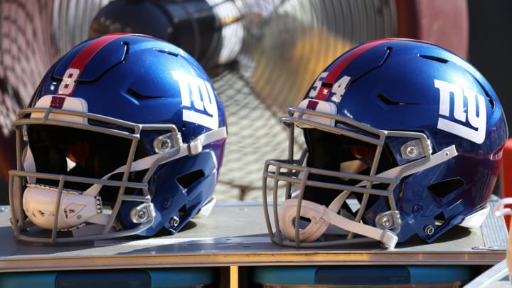 Nov 8, 2020; Landover, Maryland, USA; A view of the helmets of New York Giants quarterback Daniel Jones (8) and Giants inside linebacker Blake Martinez (54) resting on equipment case on the sidelines against the Washington Football Team at FedExField.  