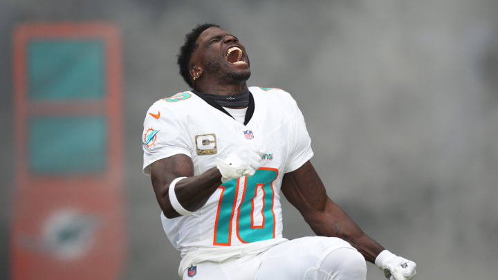 Miami Dolphins wide receiver Tyreek Hill (10) runs onto the field during pregame ceremonies of an NFL game against the Las Vegas Raiders at Hard Rock Stadium in Miami Gardens, Nov. 19, 2023.