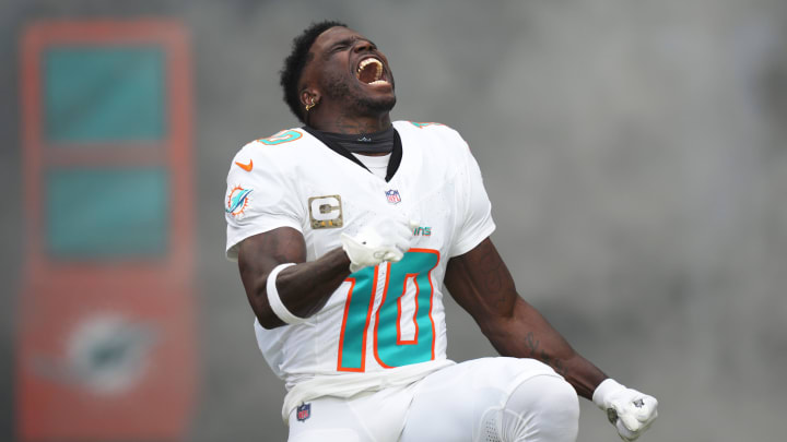 Miami Dolphins wide receiver Tyreek Hill (10) runs onto the field during pregame ceremonies of an NFL game against the Las Vegas Raiders at Hard Rock Stadium in Miami Gardens, Nov. 19, 2023.