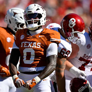 Texas Longhorns linebacker Anthony Hill Jr. (0) celebrates after a defensive stop against the Oklahoma Sooners during the first half at the Cotton Bowl.
