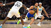 Dec 23, 2024; San Francisco, California, USA; Golden State Warriors guard Stephen Curry (30) drives to the basket against Indiana Pacers guard Bennedict Mathurin (00) and guard Andrew Nembhard (2) in the fourth quarter at Chase Center. Mandatory Credit: Eakin Howard-Imagn Images