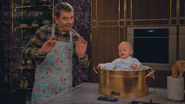 (L to R) Rowan Atkinson as Trevor Bingley, Baby Jesus, in Man Vs Baby