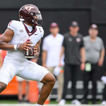 Aug 31, 2024; Nashville, Tennessee, USA;  Virginia Tech Hokies quarterback Kyron Drones (1) stands in the pocket during the second half at FirstBank Stadium. Mandatory Credit: Steve Roberts-Imagn Images