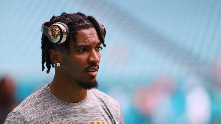 Aug 17, 2024; Miami Gardens, Florida, USA; Washington Commanders quarterback Jayden Daniels (5) looks on from the field before a preseason game against the Miami Dolphins at Hard Rock Stadium. Mandatory Credit: Sam Navarro-USA TODAY Sports