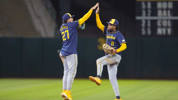 Aug 23, 2024; Oakland, California, USA; Milwaukee Brewers shortstop Willy Adames (27) celebrates with left fielder Jackson Chourio (11) after defeating the Oakland Athletics at Oakland-Alameda County Coliseum. Mandatory Credit: Darren Yamashita-USA TODAY Sports