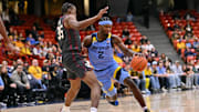 Nov 28, 2025; Chicago, Illinois, USA; Marquette Golden Eagles guard Chase Ross (2) drives against Oklahoma Sooners forward Derrion Reid (35) during the second half at Credit Union 1 Arena.