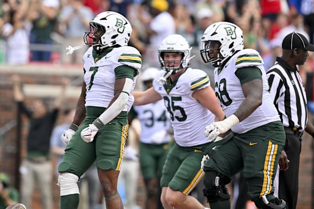 Baylor RB Bryson Washington and RG Omar Aigbedion