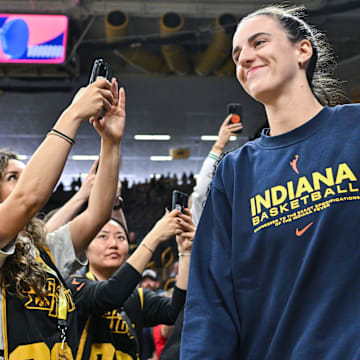 May 4, 2025; Iowa City, IA, USA; Indiana Fever guard Caitlin Clark (22) walks onto the court before the game against the Brazil National Team at Carver-Hawkeye Arena. Mandatory Credit: Jeffrey Becker-Imagn Images